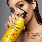 Model gripping Bumbee Conditioner with propolis for hydration and color preservation, in a sleek 500ml bottle.