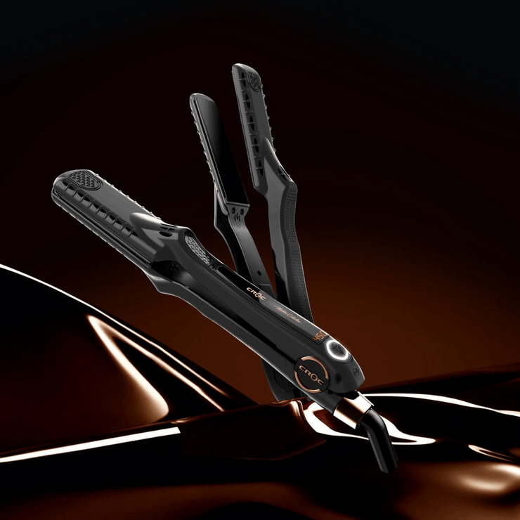 Master Black Titanium Flat Iron with ergonomic design and deluxe thumb grip for comfortable styling.