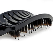 Round vented hair brush featuring natural boar bristles for efficient styling and even heat distribution